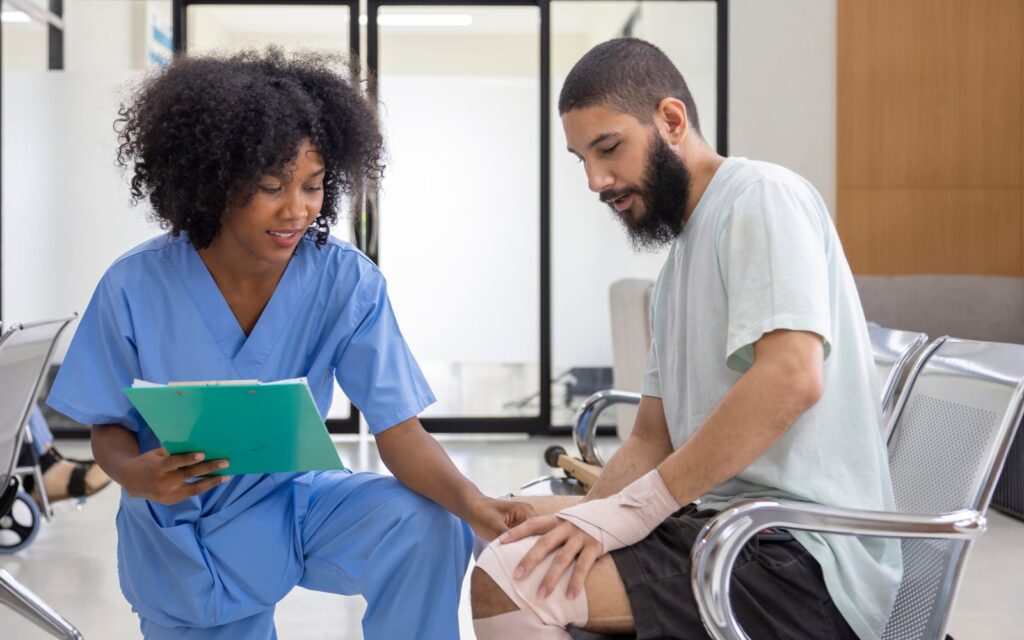 Nurse is examining tendinitis on knee injury